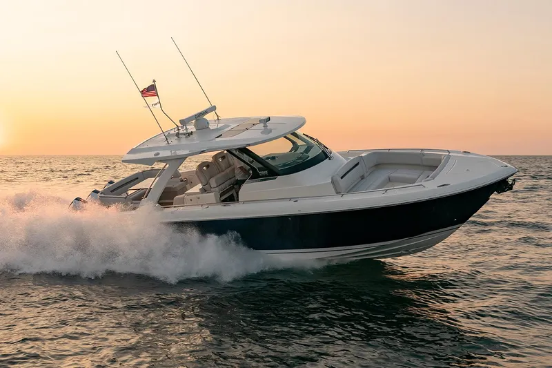  Yacht Photos Pics Manufacturer Provided Image: 2025 Tiara Yachts 38 LS cruising at sunset on open water.