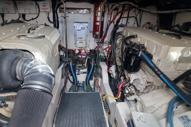 Cruse Yacht Photos Pics Engine room of 2006 Tiara Yachts 4200 Open, showcasing dual engines and wiring.