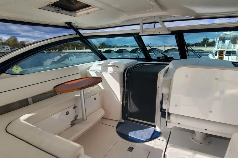 Cruse Yacht Photos Pics 2006 Tiara Yachts 4200 Open interior with seating and table, showcasing luxury design.