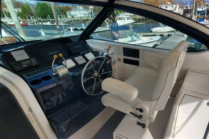 Cruse Yacht Photos Pics 2006 Tiara Yachts 4200 Open helm with Garmin navigation, docked at marina.