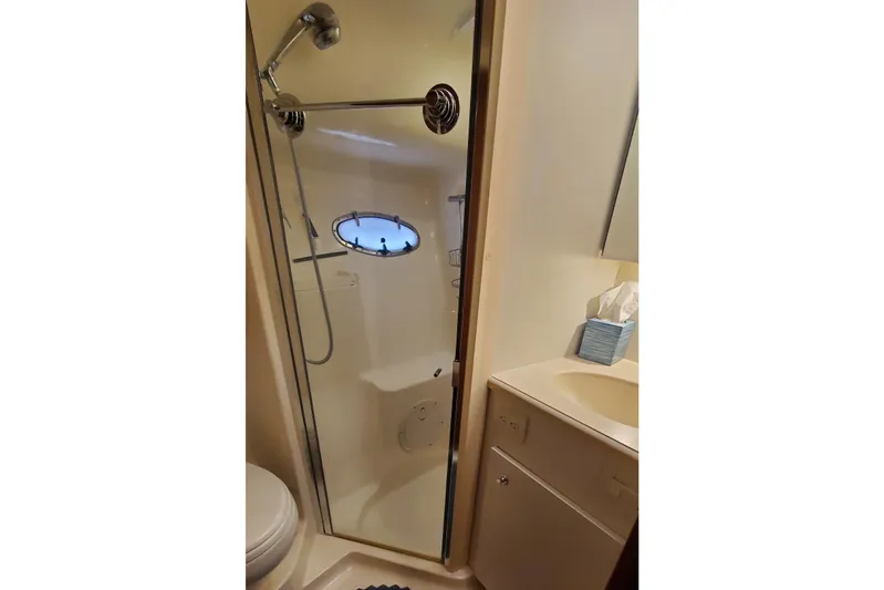 Cruse Yacht Photos Pics Bathroom interior of 2006 Tiara Yachts 4200 Open with shower and sink.