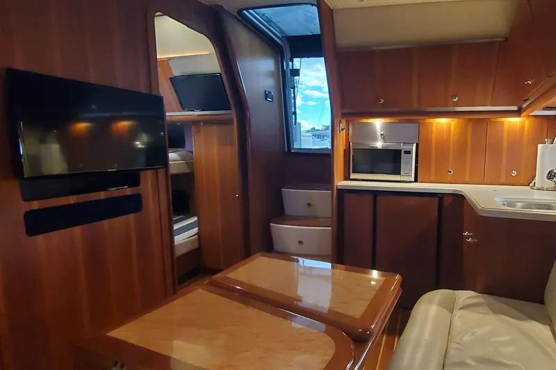 Cruse Yacht Photos Pics Luxurious interior of 2006 Tiara Yachts 4200 Open with wood finish and modern amenities.