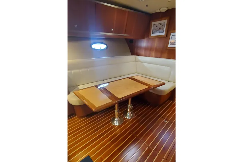 Cruse Yacht Photos Pics Luxurious interior of 2006 Tiara Yachts 4200 Open with elegant wood flooring and seating.