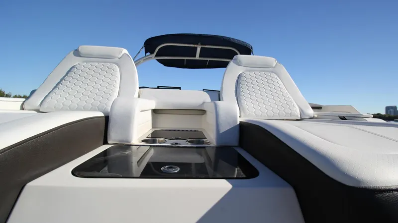 Finding Dori Yacht Photos Pics 2017 Sea Ray SDX 290 Outboard boat interior with white seating and blue canopy.