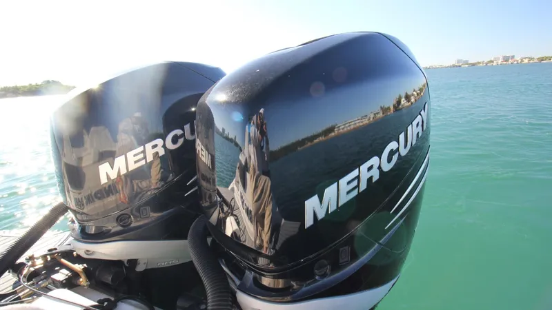Finding Dori Yacht Photos Pics Twin Mercury outboard engines on a 2017 Sea Ray SDX 290, cruising on clear waters.