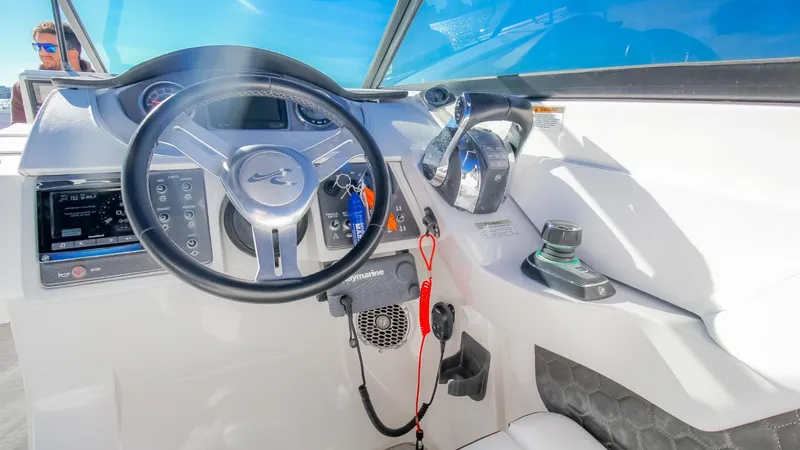 Finding Dori Yacht Photos Pics Cockpit of 2017 Sea Ray SDX 290 Outboard, featuring steering wheel and controls.
