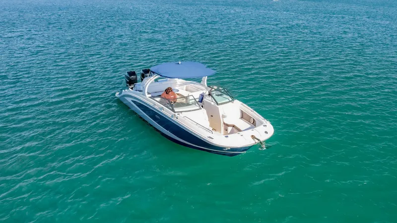 Finding Dori Yacht Photos Pics 2017 Sea Ray SDX 290 Outboard boat cruising on clear blue water.