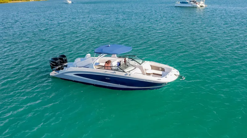 Finding Dori Yacht Photos Pics 2017 Sea Ray SDX 290 Outboard boat cruising on clear blue water.