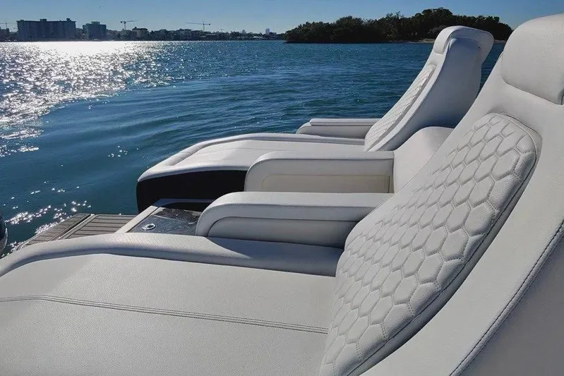 Finding Dori Yacht Photos Pics Luxurious seating on 2017 Sea Ray SDX 290 Outboard, overlooking serene water.