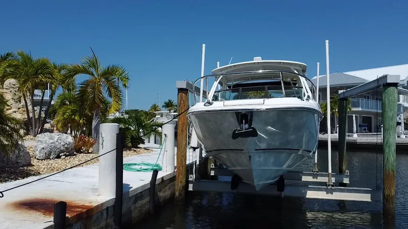  Yacht Photos Pics 2019 Boston Whaler 270 Vantage docked at marina with palm trees.
