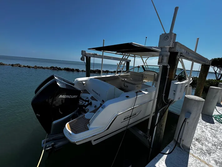  Yacht Photos Pics 2019 Boston Whaler 270 Vantage boat docked with Mercury engine, sunny day.