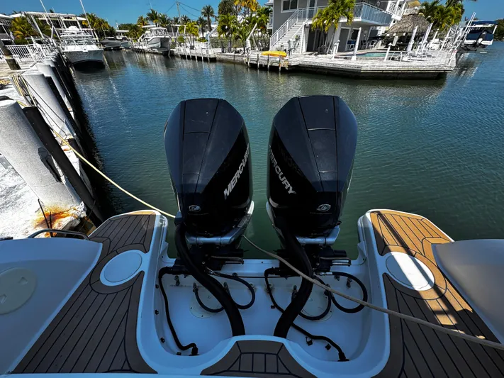  Yacht Photos Pics 2019 Boston Whaler 270 Vantage with twin Mercury outboard engines docked at marina.