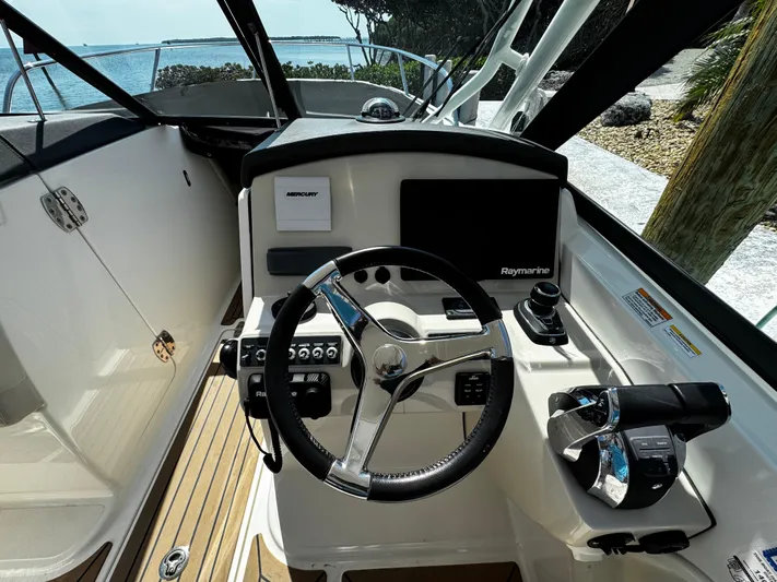  Yacht Photos Pics 2019 Boston Whaler 270 Vantage helm with steering wheel and controls.