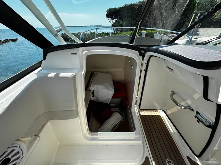  Yacht Photos Pics 2019 Boston Whaler 270 Vantage interior storage compartment with scenic ocean view.