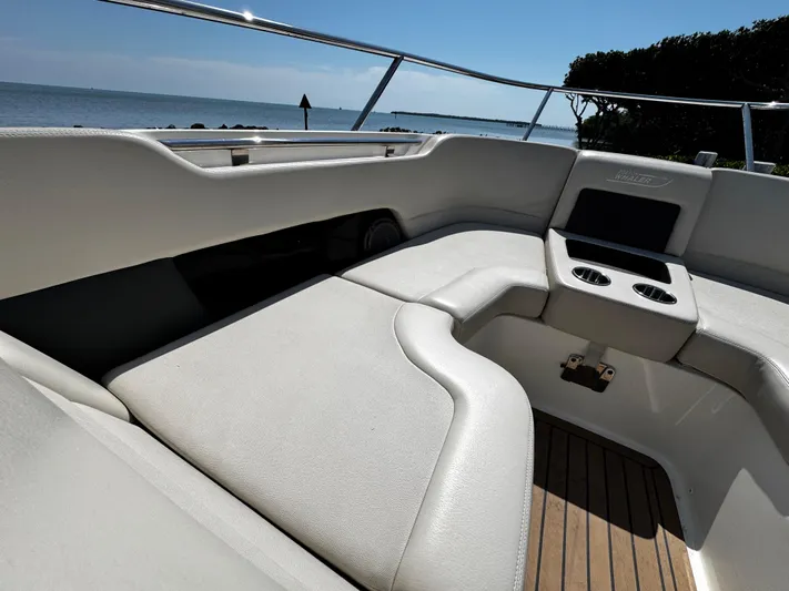  Yacht Photos Pics 2019 Boston Whaler 270 Vantage boat interior with cushioned seating and cup holders.