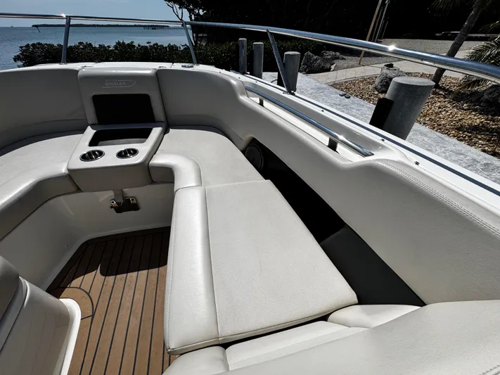  Yacht Photos Pics 2019 Boston Whaler 270 Vantage boat interior with cushioned seating and cup holders.