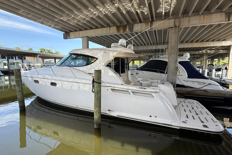 Yacht Photos Pics 2011 Tiara Yachts 4500 Sovran docked under a covered marina.