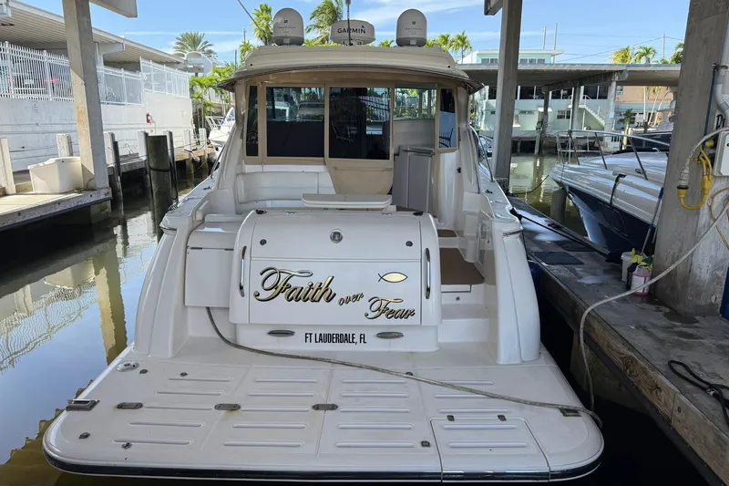  Yacht Photos Pics 2011 Tiara Yachts 4500 Sovran docked, featuring "Faith over Fear" text on the stern.