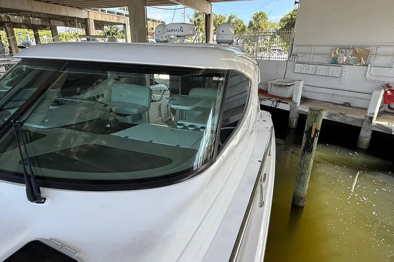  Yacht Photos Pics 2011 Tiara Yachts 4500 Sovran docked, showcasing sleek design and modern navigation equipment.