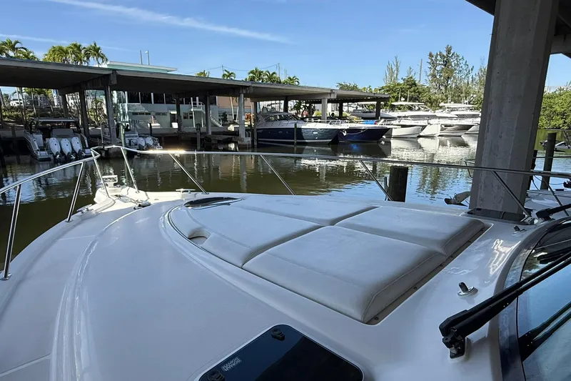  Yacht Photos Pics 2011 Tiara Yachts 4500 Sovran docked at marina, sunny day, calm waters.