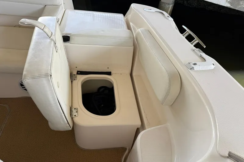  Yacht Photos Pics 2011 Tiara Yachts 4500 Sovran seating area with storage compartment open.