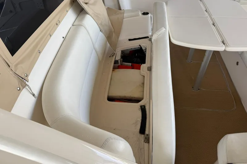  Yacht Photos Pics 2011 Tiara Yachts 4500 Sovran interior seating with storage compartment open.