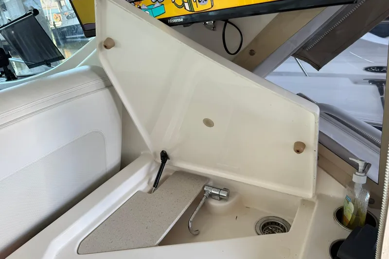  Yacht Photos Pics Interior sink area of a 2011 Tiara Yachts 4500 Sovran with a faucet and soap dispenser.