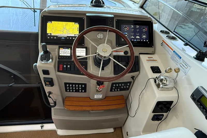  Yacht Photos Pics 2011 Tiara Yachts 4500 Sovran helm with navigation screens and controls.