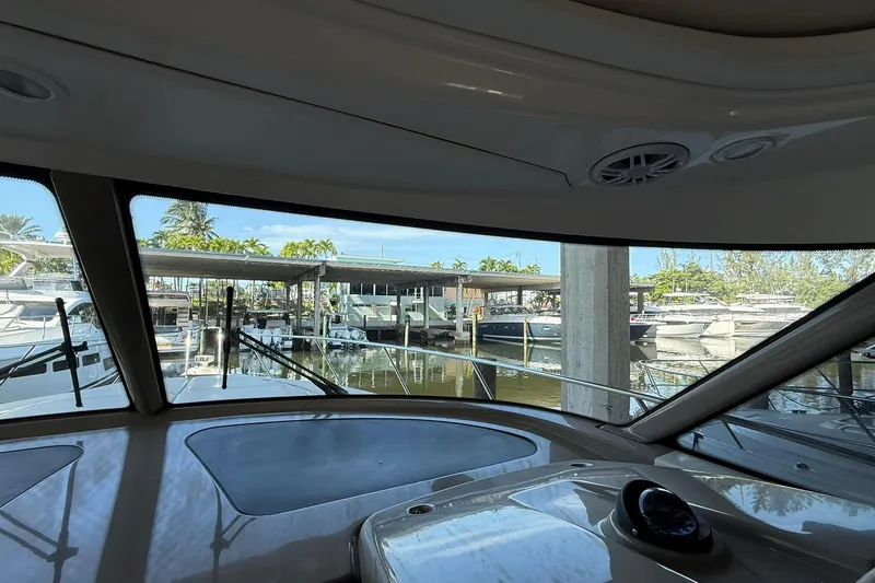  Yacht Photos Pics Interior view from 2011 Tiara Yachts 4500 Sovran, overlooking marina with docked boats.