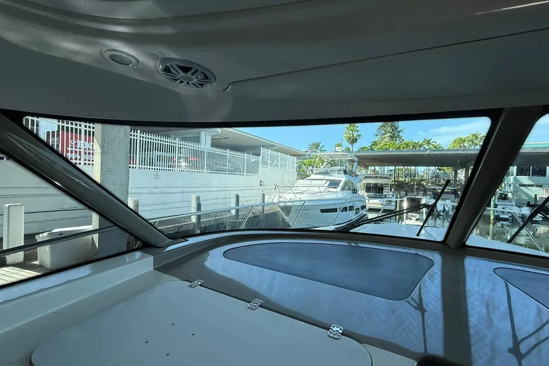  Yacht Photos Pics Interior view from 2011 Tiara Yachts 4500 Sovran, overlooking marina with docked boats.