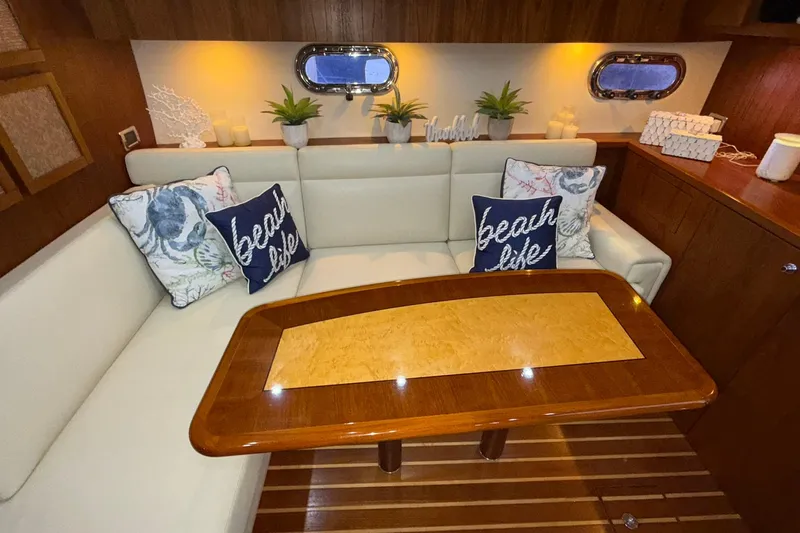  Yacht Photos Pics Luxurious 2011 Tiara Yachts 4500 Sovran interior with cozy seating and nautical decor.