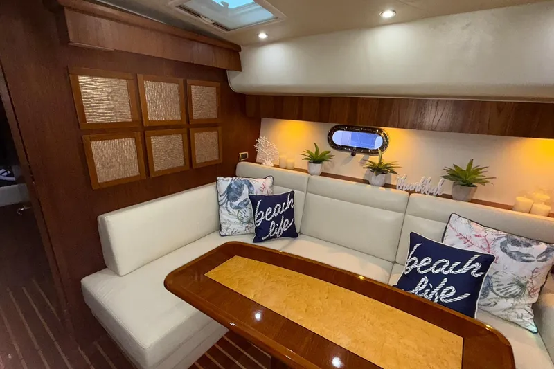  Yacht Photos Pics Interior of 2011 Tiara Yachts 4500 Sovran with elegant seating and decorative pillows.