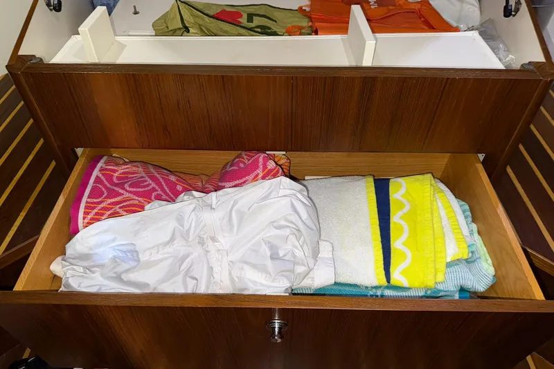  Yacht Photos Pics Drawer in 2011 Tiara Yachts 4500 Sovran with colorful towels and clothing.