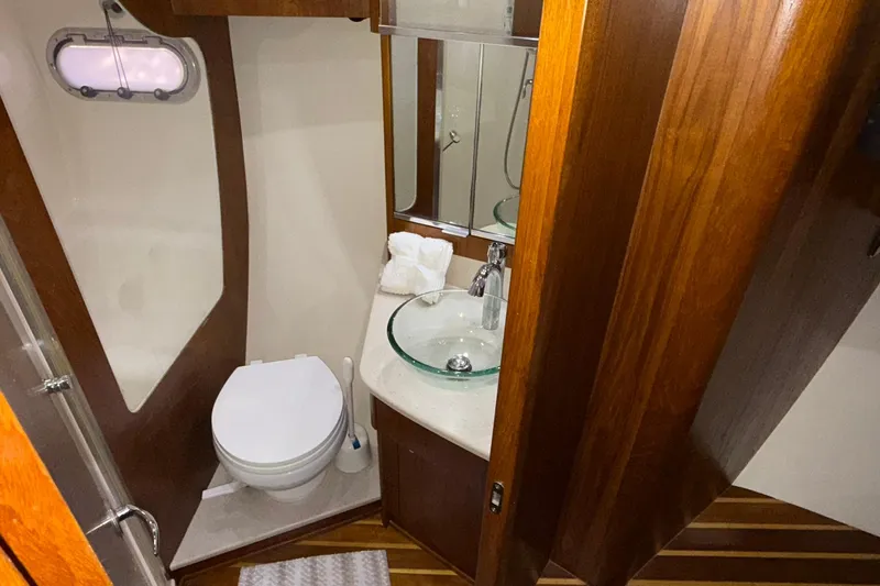  Yacht Photos Pics Luxurious bathroom in 2011 Tiara Yachts 4500 Sovran with wood accents and modern fixtures.