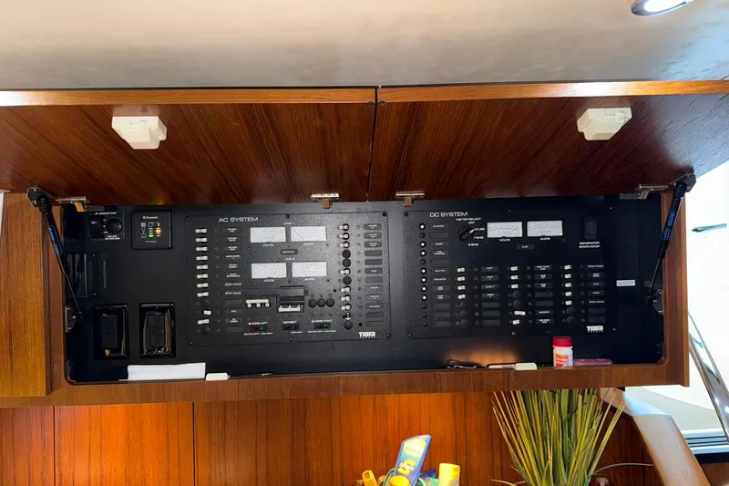  Yacht Photos Pics Electrical panel of 2011 Tiara Yachts 4500 Sovran, showcasing AC and DC systems.