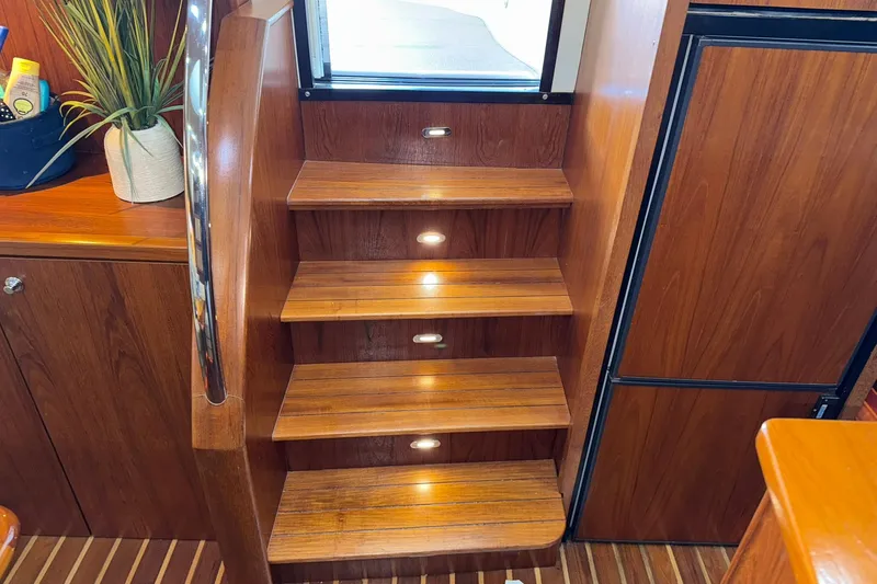  Yacht Photos Pics Wooden interior stairs with lighting on a 2011 Tiara Yachts 4500 Sovran.