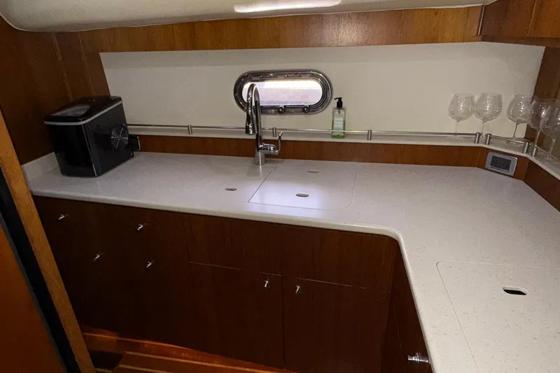  Yacht Photos Pics 2011 Tiara Yachts 4500 Sovran galley with modern countertop and sink.