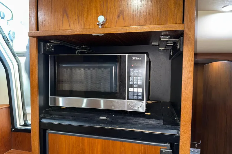  Yacht Photos Pics Microwave in 2011 Tiara Yachts 4500 Sovran, wooden cabinetry, modern design.