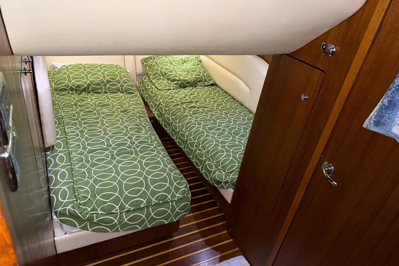  Yacht Photos Pics 2011 Tiara Yachts 4500 Sovran cabin with twin beds and green patterned bedding.