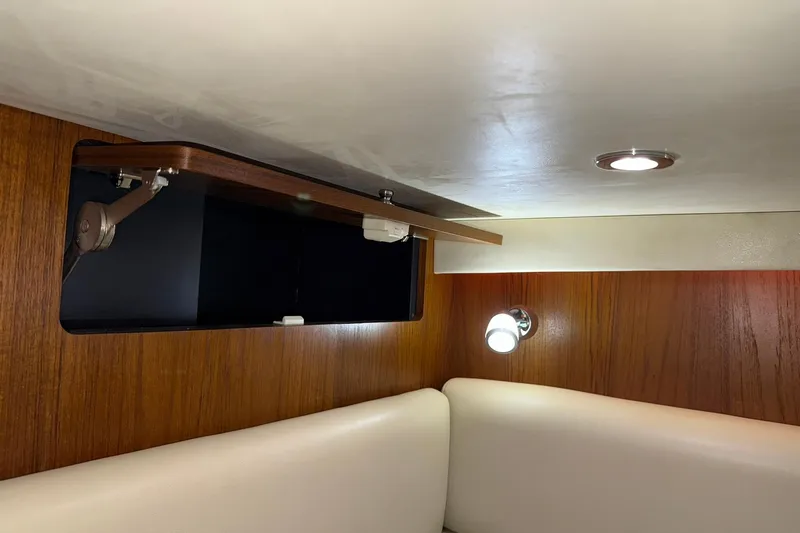  Yacht Photos Pics Interior of 2011 Tiara Yachts 4500 Sovran with wood paneling and modern lighting.