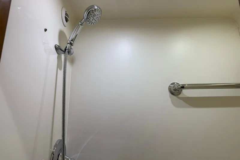  Yacht Photos Pics Shower area in 2011 Tiara Yachts 4500 Sovran, featuring chrome fixtures and grab bar.