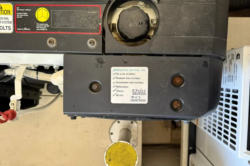  Yacht Photos Pics Engine compartment of a 2011 Tiara Yachts 4500 Sovran with service label visible.