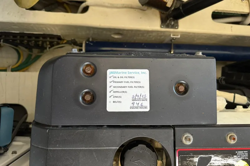  Yacht Photos Pics Engine compartment of a 2011 Tiara Yachts 4500 Sovran with service label details.