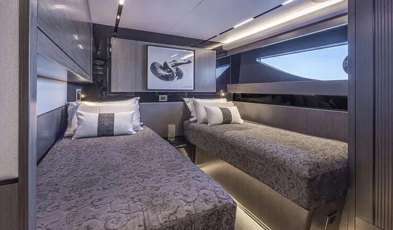  Yacht Photos Pics Luxurious twin cabin interior of 2025 Pearl 82 yacht, featuring elegant bedding and modern design.