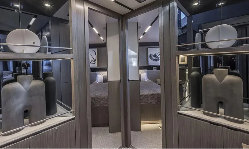 Yacht Photos Pics Luxurious interior of 2025 Pearl 82 yacht with modern decor and elegant bedroom.