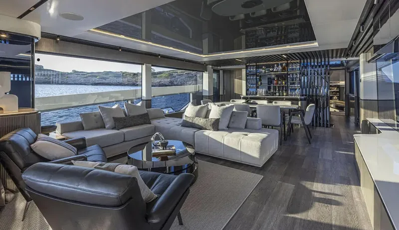  Yacht Photos Pics Luxurious interior of 2025 Pearl 82 yacht with modern furnishings and ocean view.