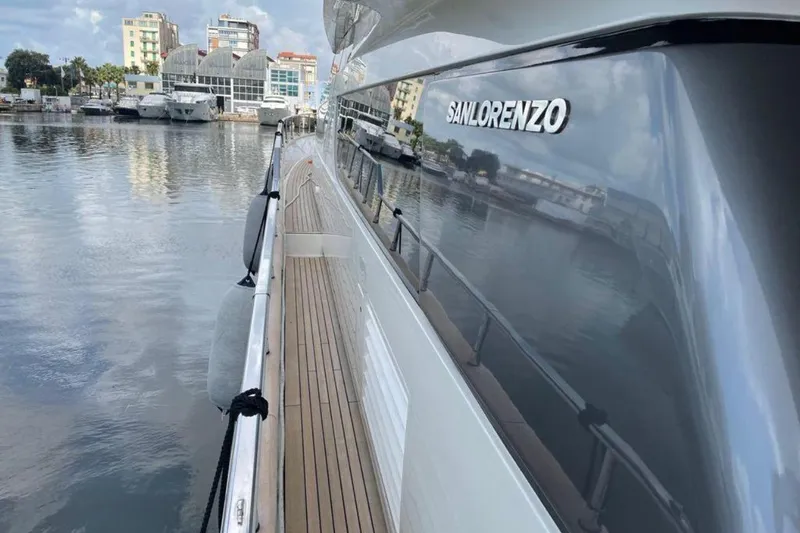  Yacht Photos Pics Sanlorenzo SL72 yacht docked, showcasing sleek design and reflective surface, 2010 model.