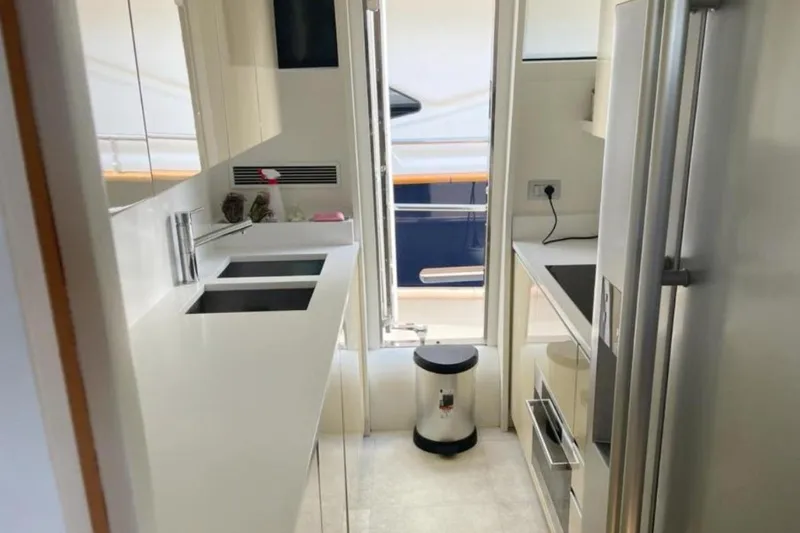  Yacht Photos Pics Modern kitchen interior of 2010 Sanlorenzo SL72 yacht, featuring sleek countertops and appliances.