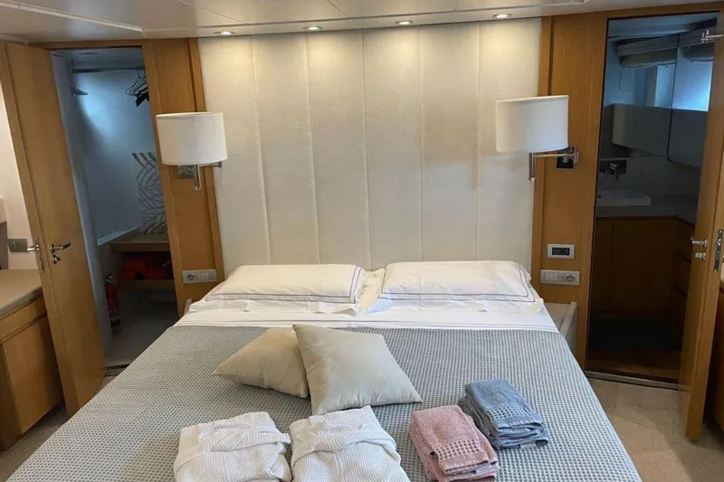  Yacht Photos Pics Luxurious bedroom interior on 2010 Sanlorenzo SL72 yacht with neatly arranged linens.