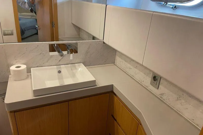  Yacht Photos Pics Modern bathroom on 2010 Sanlorenzo SL72 yacht with sleek sink and marble accents.